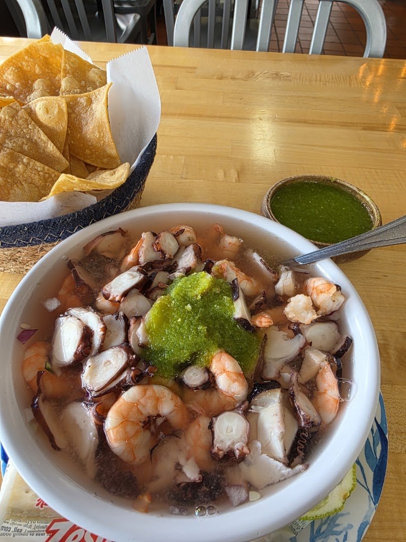 Mexican seafood plates with bright garnishes.
