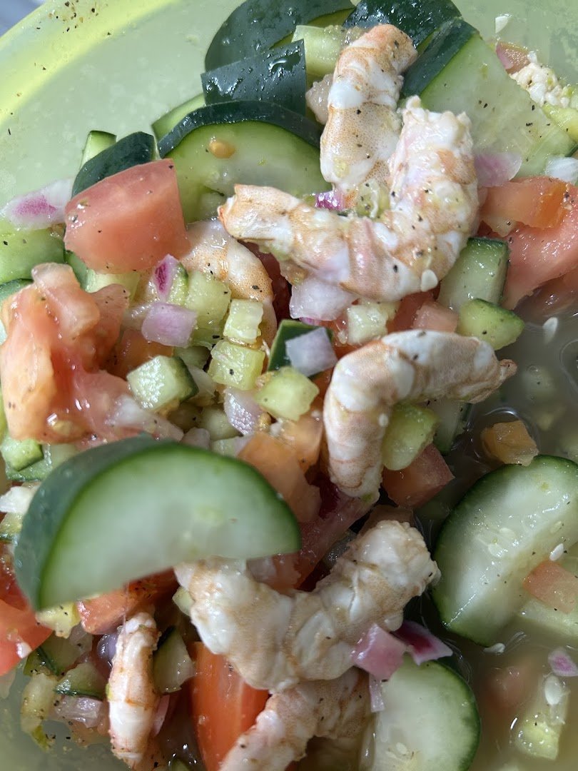 Shrimp ceviche served in a simple setting.