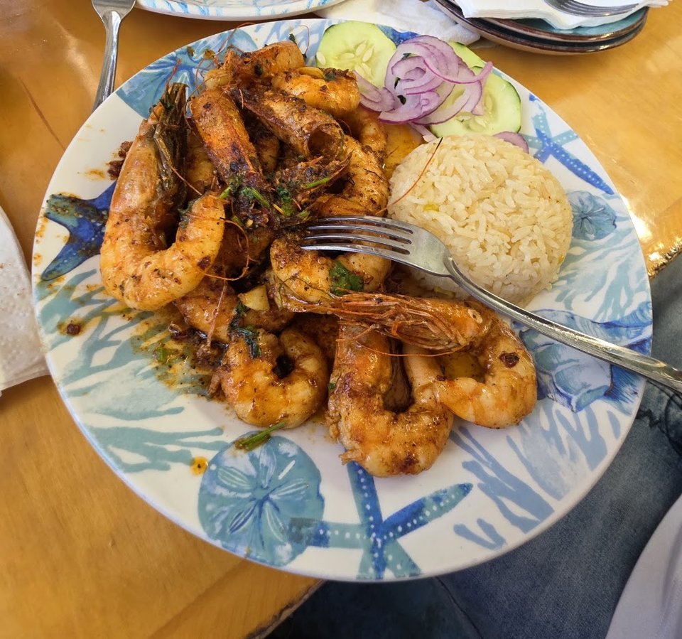 Menu page with ceviche and shrimp dishes.