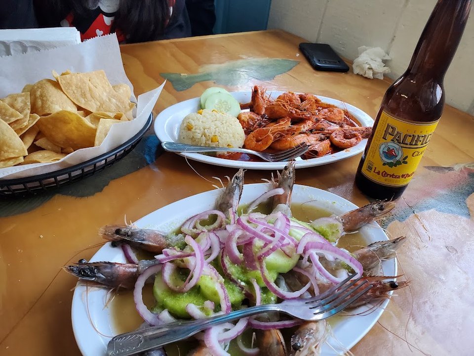 Menu page with ceviche and shrimp dishes.